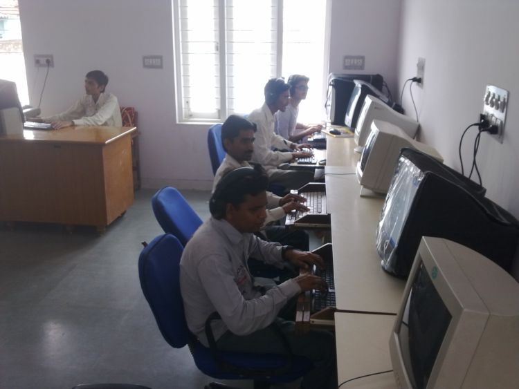 Visually impaired students using computers with screen readers at AKTrust Computer Education Centre